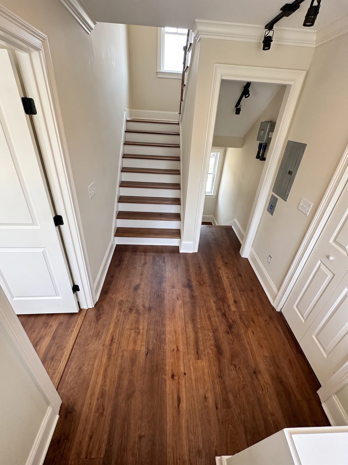 Hardwood stairs after installation by Paez And More